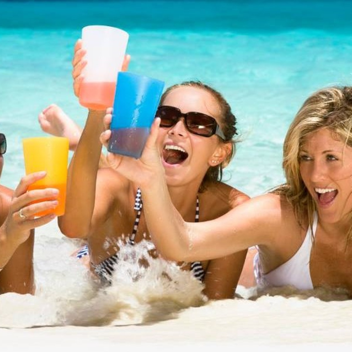 girls drinking on beach
